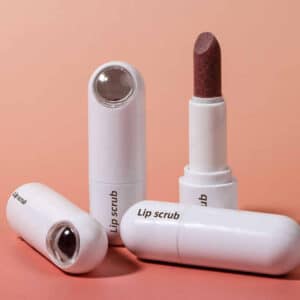 Private Label Lip Scrub stick in use, gently exfoliating lips