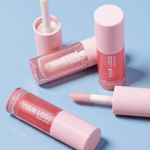 A collection of private label tinted lip oils from manufacturer KNY Cosmetics, showcasing the clear, hydrating organic formula ready for B2B branding.