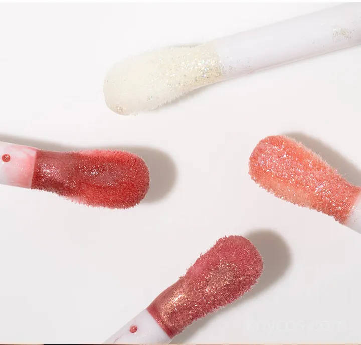 Private label plumping shine lip gloss in sleek tube, featuring multidimensional shine and instant plumping effect for fuller-looking lips.