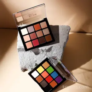 Private label 12-color eyeshadow palette in sleek compact, featuring matte, shimmer, and glitter finishes for versatile eye looks.