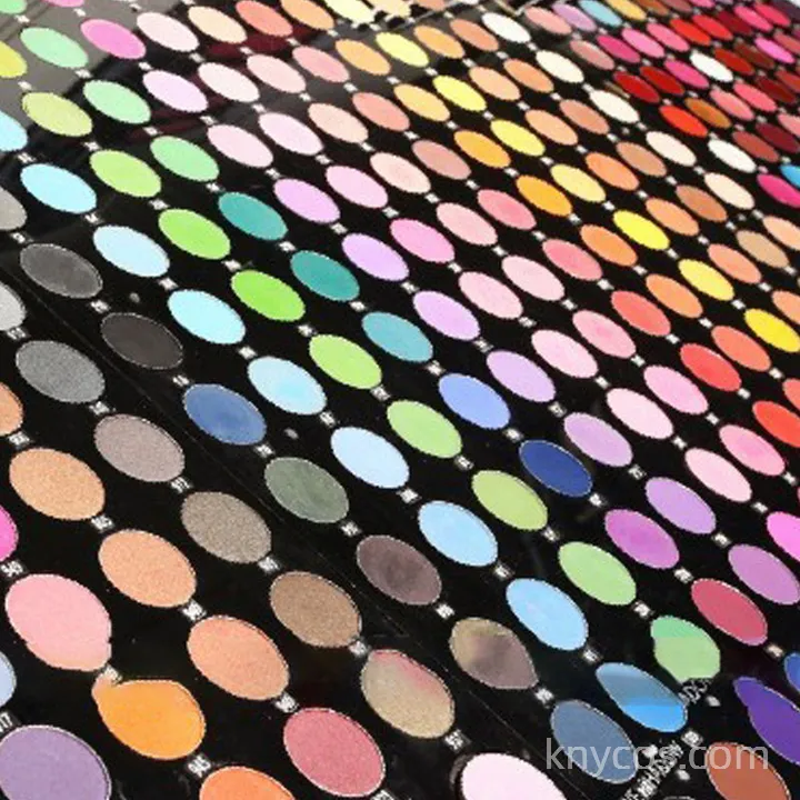 Private label 12-color eyeshadow palette in sleek compact, featuring matte, shimmer, and glitter finishes for versatile eye looks.